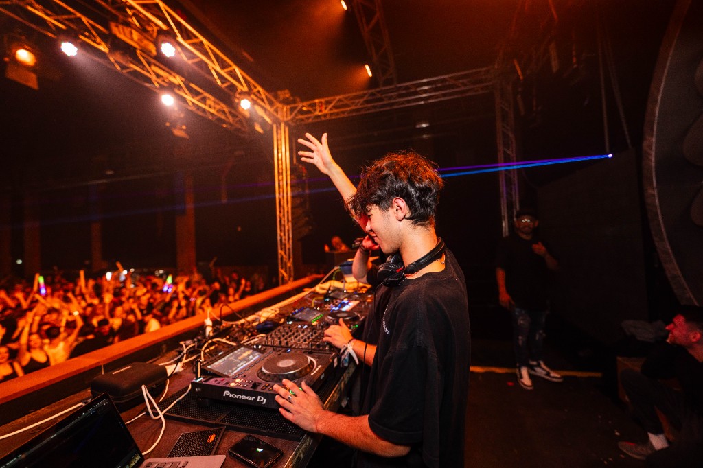 Pytro performing on stage in front of a crowd